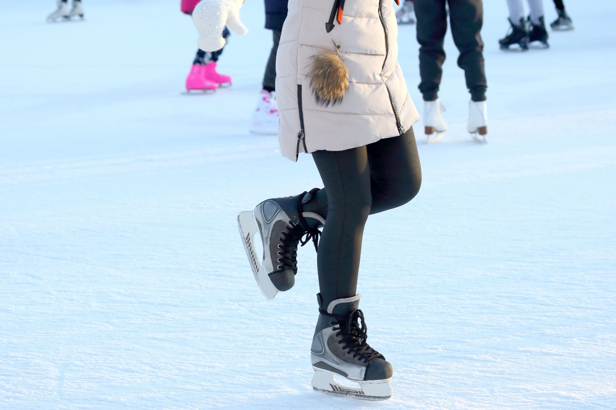 Feet Skating Girls on Skates at the Ice Arena.